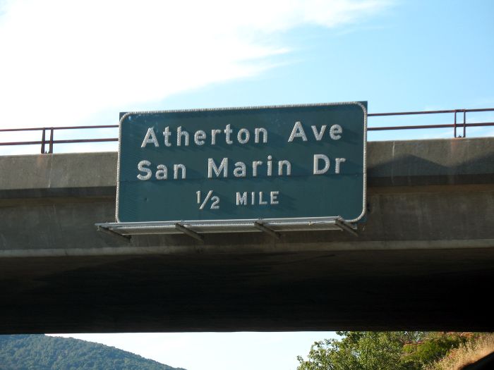 Button reflectors on an exit sign along US 101 in Novato, California