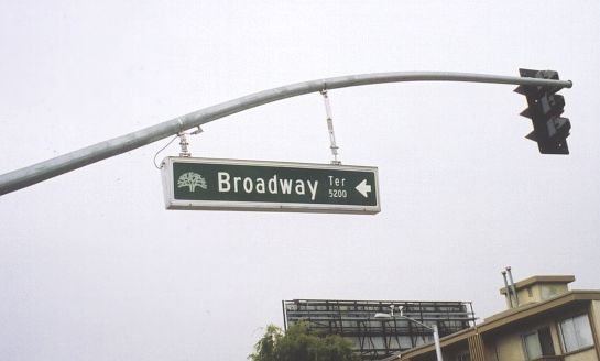 Illuminated overhead street sign in Oakland, California
