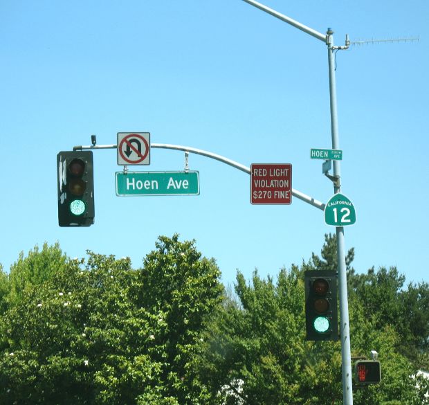 Multiple signs on signal mast in Santa Rosa, California
