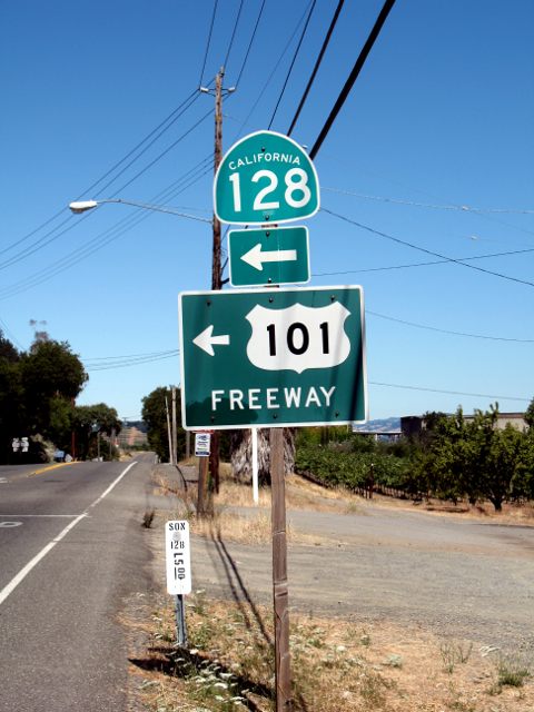 Direction signs for routes out of Geyserville, California