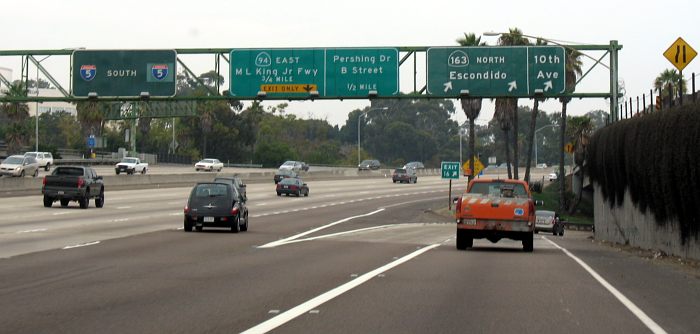 California 163 exit with advance sign for another freeway in San Diego