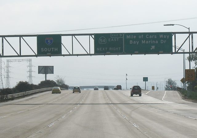 Exit sign for the Mile of Cars on southbound Interstate 5 in National City, California