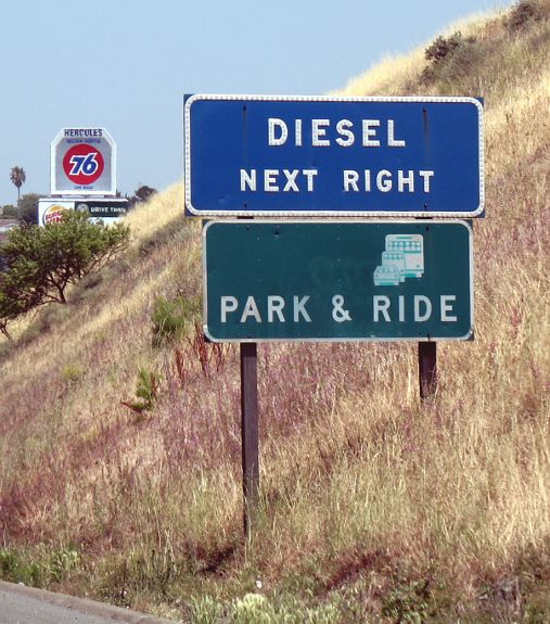 Button reflectors on a blue services sign on Interstate 80 in Hercules, California