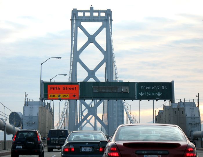 Big orange sign and big green sign for exits from Interstate 80 in San Francisco