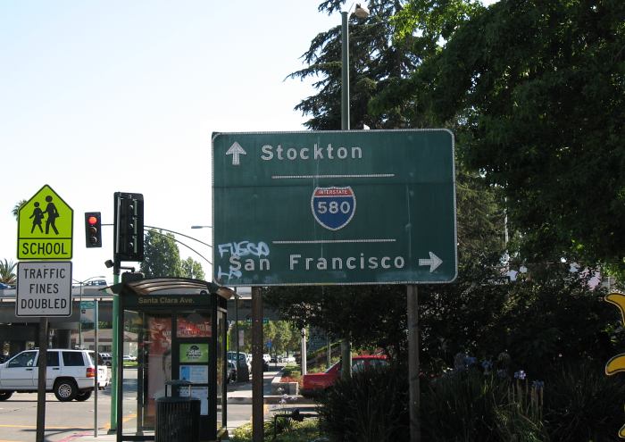 Destination sign at freeway entrance in Oakland, California
