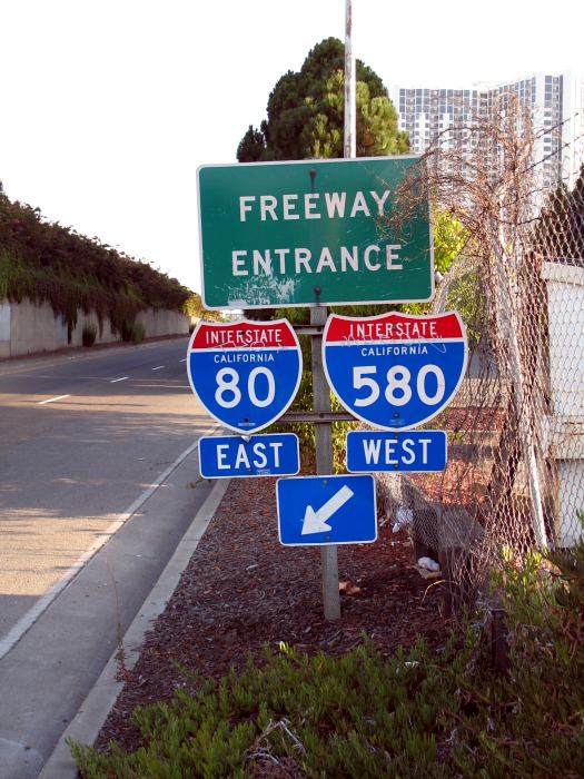 Freeway entrance on Powell Street in Emeryville, California with apparently contradictory directions
