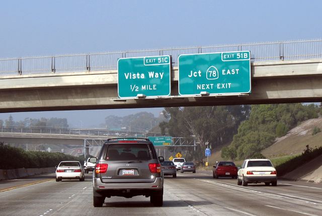Bridge-mounted advance exit signs on northbound Interstate 5 in San Diego County