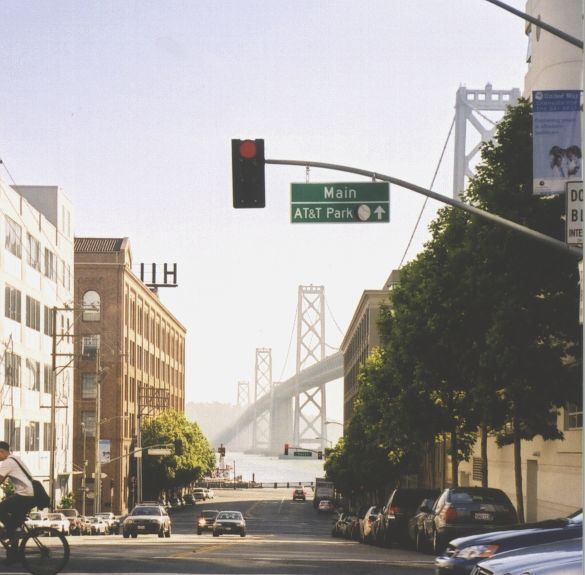 Hazy scene of the San Francisco Bay Bridge as seen from Main and Harrison streets