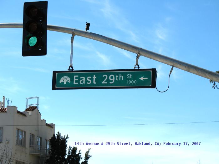 Clearview font on Oakland city street sign on signal mast at 14th Avenue