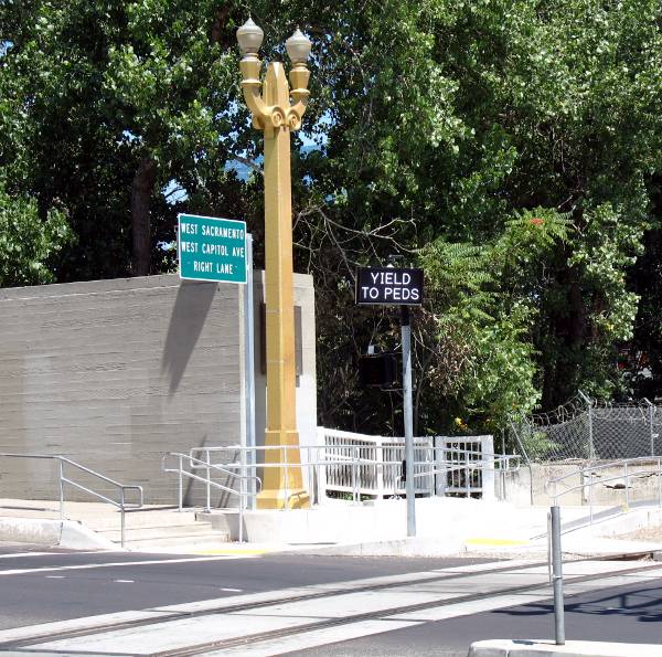 Lighted signs warning traffic to yield to pedestrians in Sacramento, California