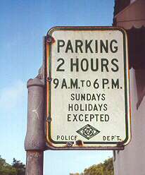 Old parking regulation sign in Pacific Grove, California