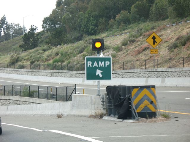 RAMP sign instead of an EXIT sign at the gore point of a California 13 exit in Oakland