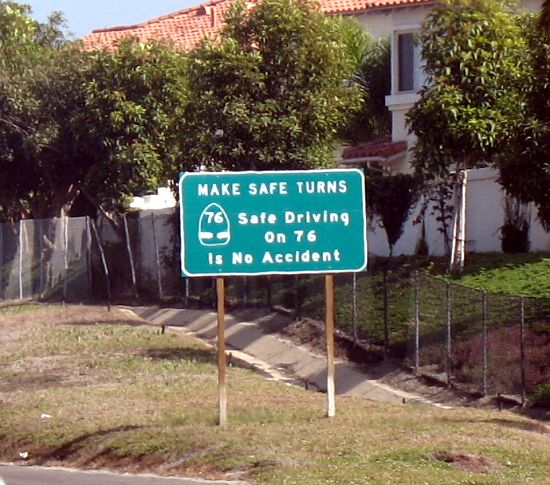 Traffic safety sign with unusual marker near Oceanside