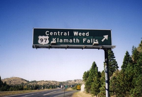 Button reflectors on US 97 exit sign at Weed, California