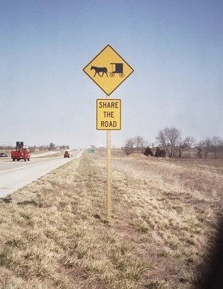 Warning sign to share the road with Amish horses and buggies near Lowry City, Mo.