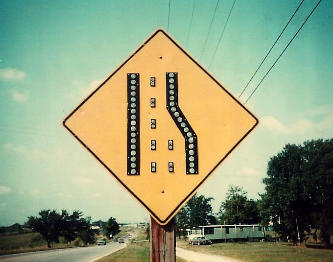 Button reflectors on sign near Boonville, Mo.