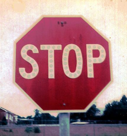 Stop sign with button reflectors at Wright City, Mo. (1975)