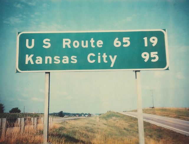 Mileage sign on Interstate 70 in Cooper County, Mo.