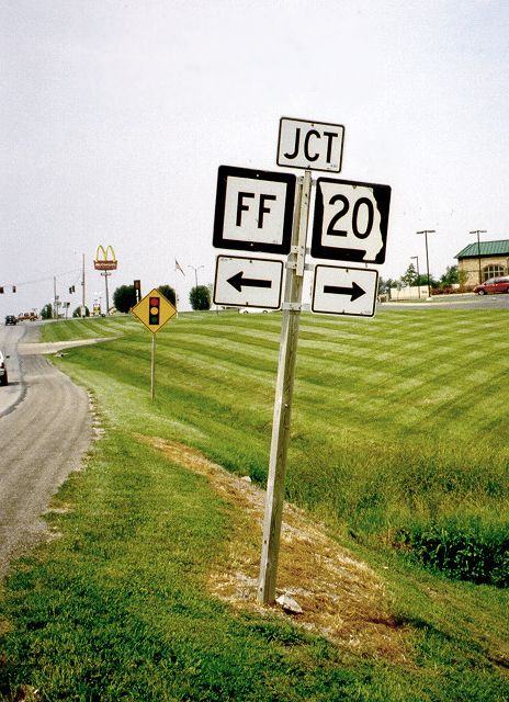 Junction with arrow markers at Missouri 13 and 20 in Higginsville