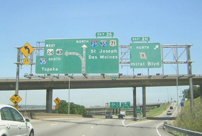 Sign for exits on the downtown freeway loop in Kansas City, Mo.