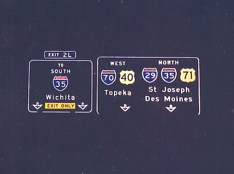 Kansas City freeway loop signs at night