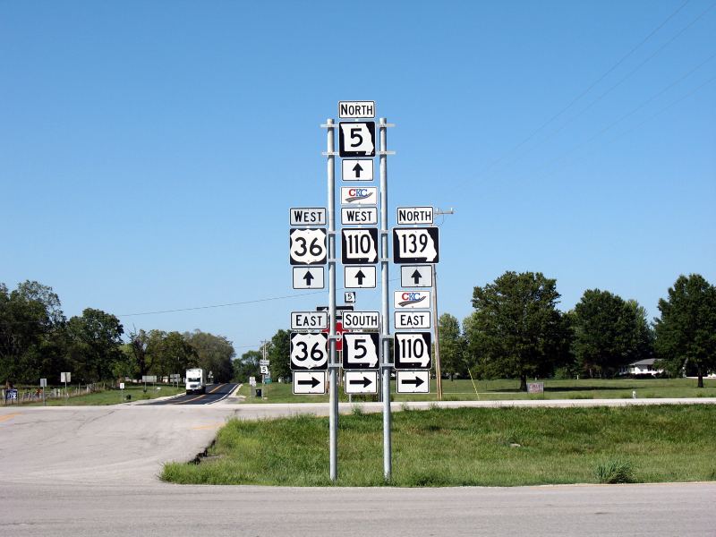 Addition of Missouri 110 designation leads to seven-sign stack of markers in Laclede