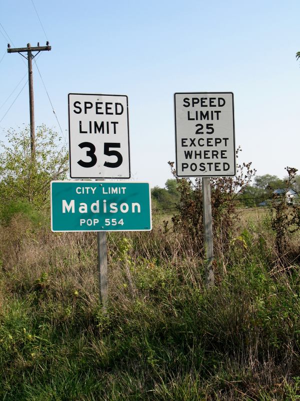 Mixed-case city-limit sign on Missouri 151 in Madison