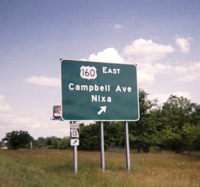 Exit sign with tacked-on state marker in Springfield, Mo.