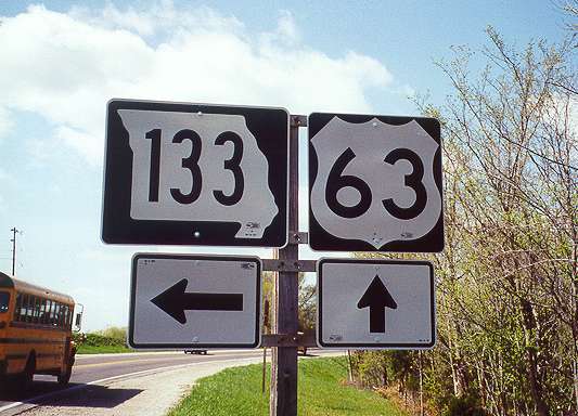 Wide-style Missouri 133 and normal US 63 marker near Westphalia
