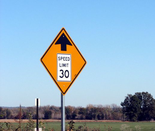 Pictographic (sort of) speed-zone-ahead sign in Elsberry, Mo.