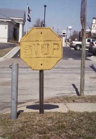 Old yellow stop sign at the Lexington, Mo. post office