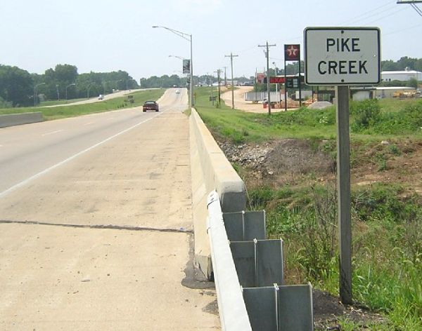Older-style sign for creek in Poplar Bluff, Mo.