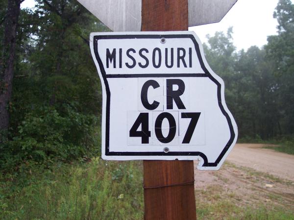 Old Missouri cutout marker re-used as a county marker
