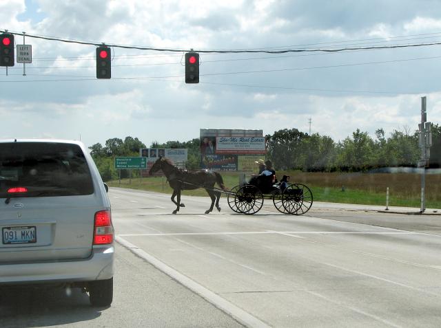 Amish horse-and-buggy crossing at the light on US 60 in Seymour, Mo.