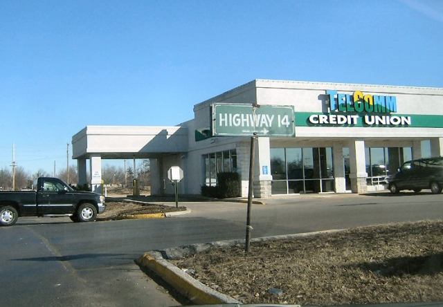 Locally made trailblazer sign for Missouri 14 in a Nixa shopping center