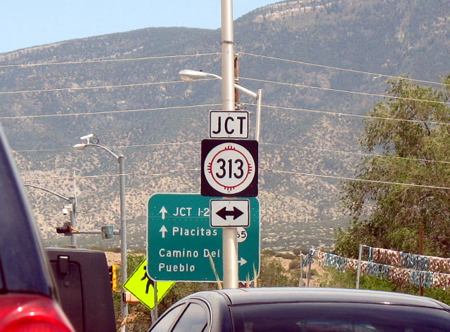 Windshield shot shows busy traffic on US 550 at the NM 313 intersection