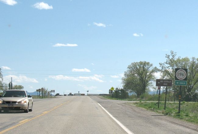 Small destination sign under NM 196 marker on NM 522