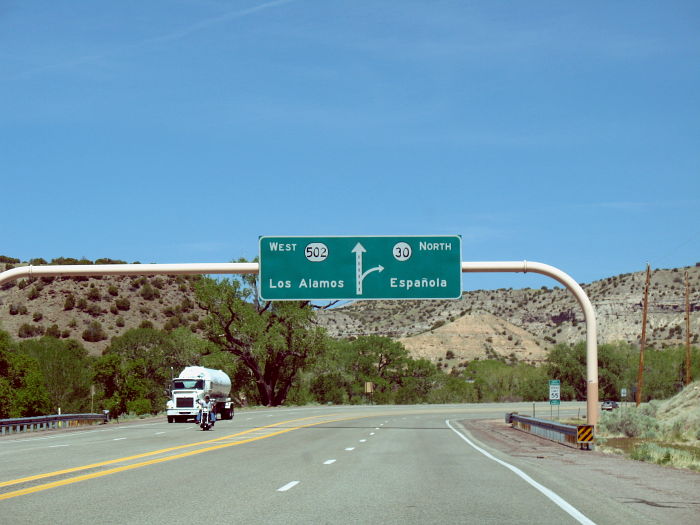 Diagram-style sign on NM 502 for its interchange with NM 30