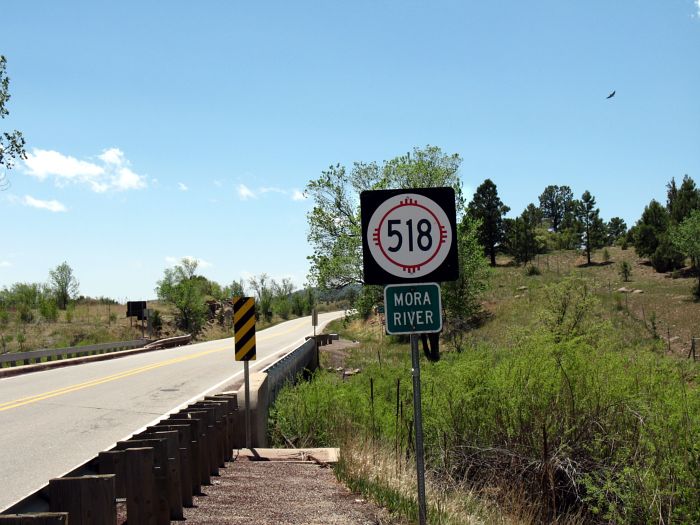 NM 518 marker at the Mora River crossing in La Cueva