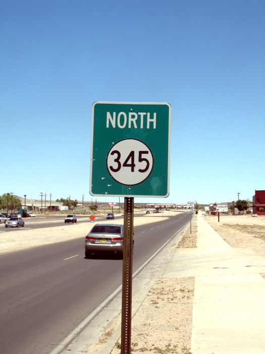 Single-panel NM 345 with cardinal direction in Albuquerque