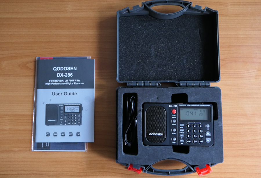 Ensemble of Qodosen DX-286 radio with carrying case and user's manual