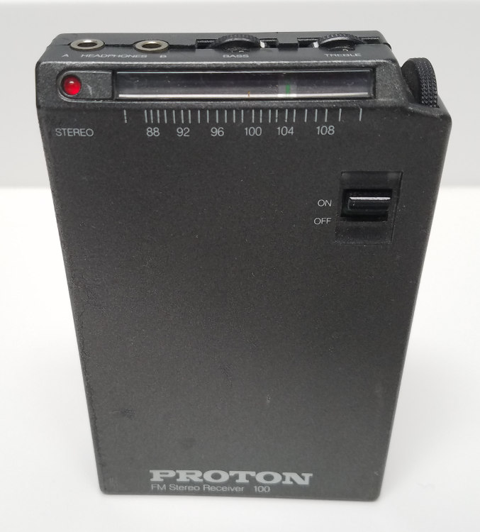 Proton 100 FM radio (angled view showing front and top of radio