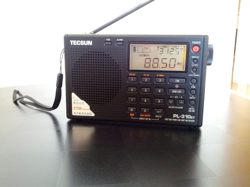 Tecsun PL-310ET AM/FM/LW/SW DSP radio, tuned to KQED-FM
