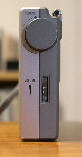 Right side of the Tecsun PL-380, showing its tuning knob and thumbwheel volume control