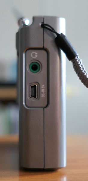 Left side of the Tecsun PL-380 AM/FM/shortwave radio, showing a mini USB port and a headphone jack