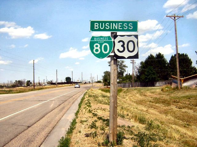 Single banner for business routes in Pine Bluffs, Wyoming