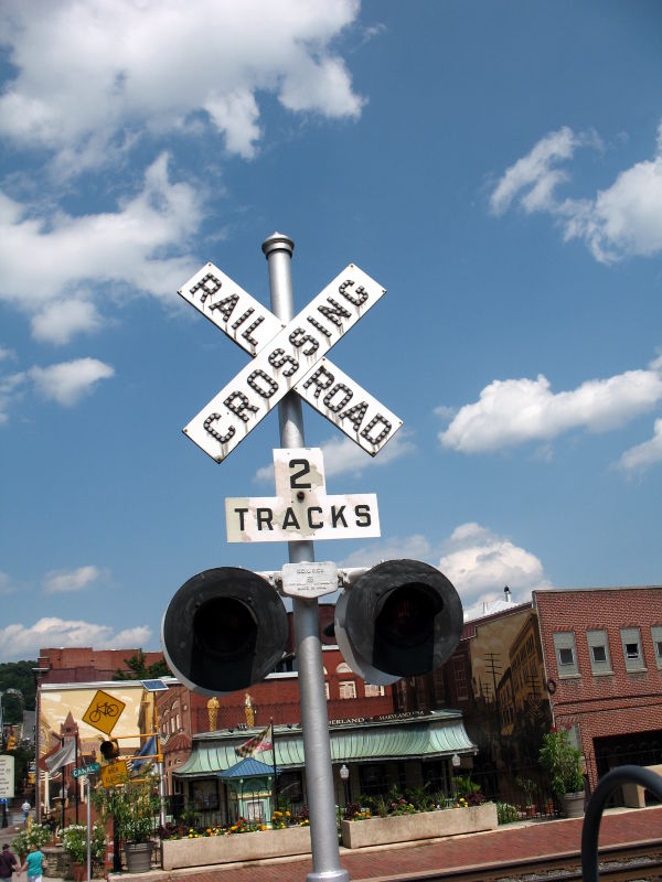 Old-style railroad-crossing sign in downtown Cumberland, Maryland