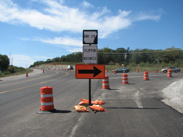 Construction sign with strange wording for a town's business district in Flippin, Arkansas