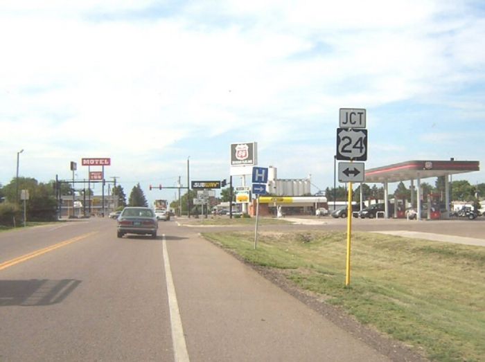 Junction of US 24 at US 385 in Burlington, Colorado, notable for including arrows on the sign assembly
