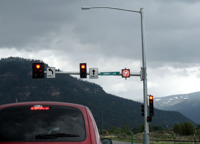 No-right-turn signal lights up alongside a railroad crossing in Durango, Colorado